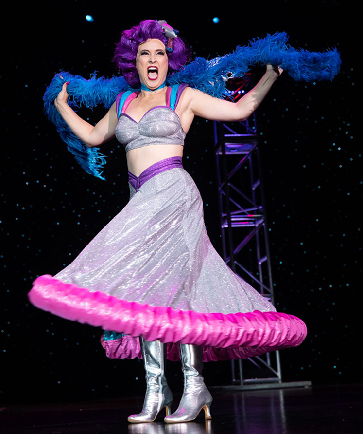 Instructor Margo Mayhem performing her Space Babe act